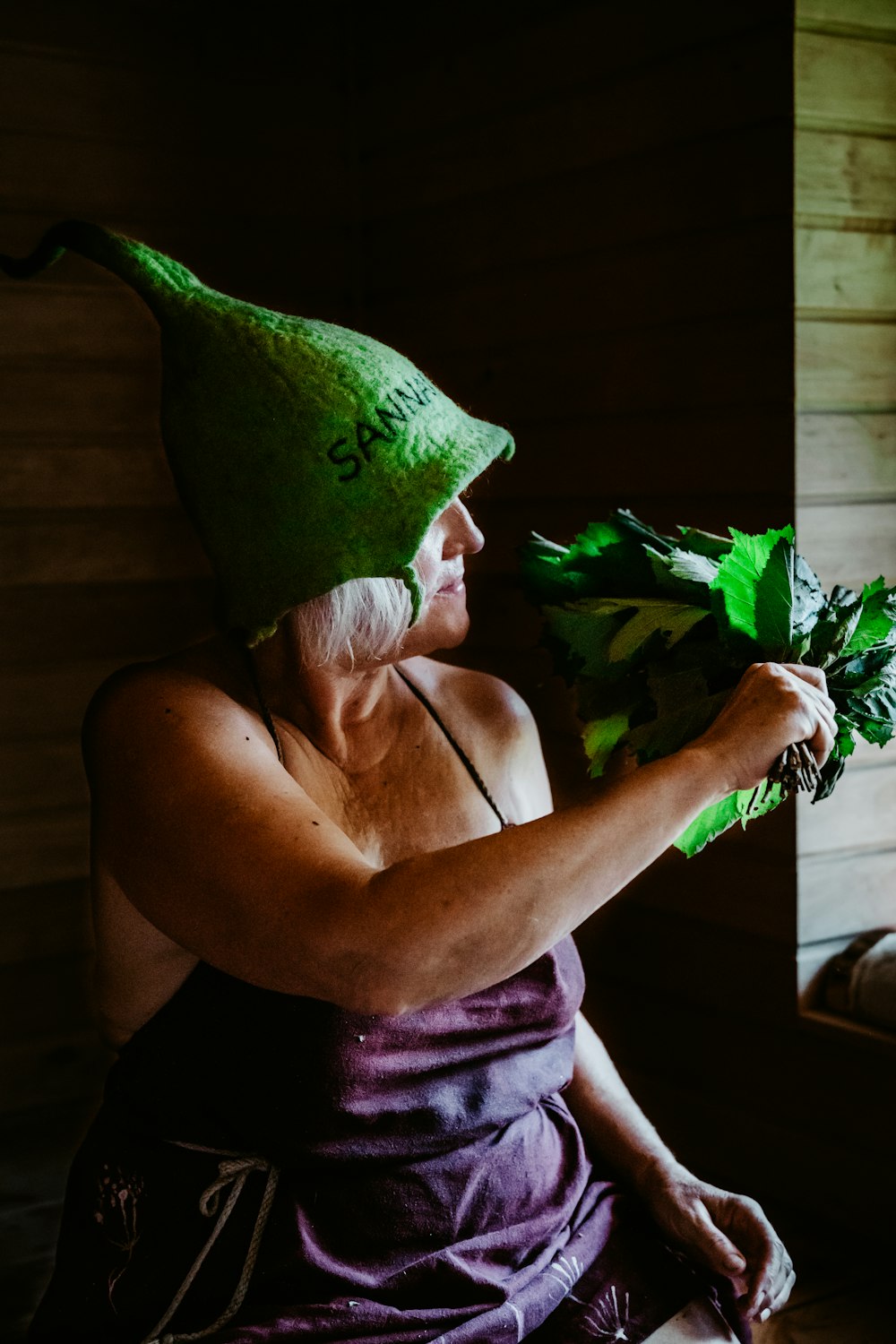 a person with a plant in the mouth