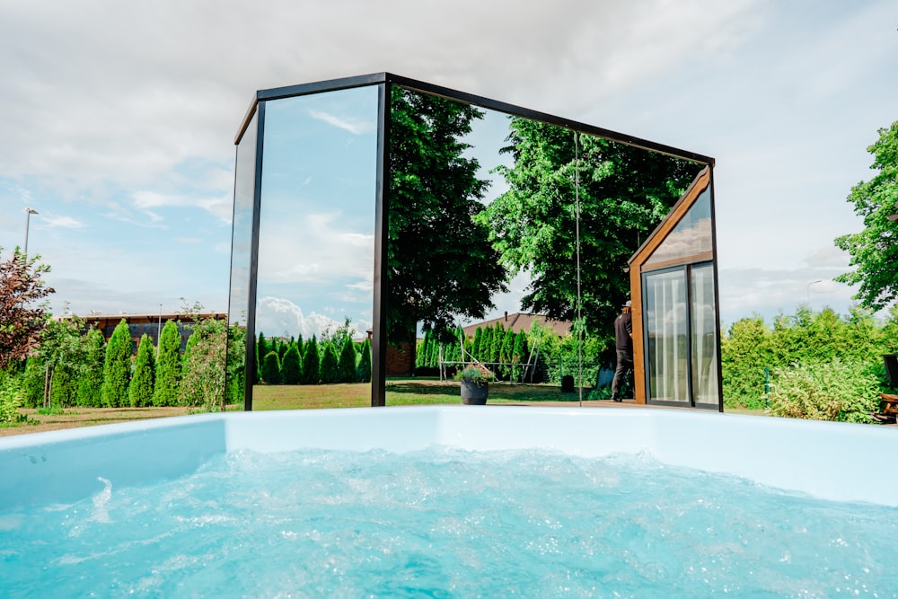a swimming pool with a glass wall