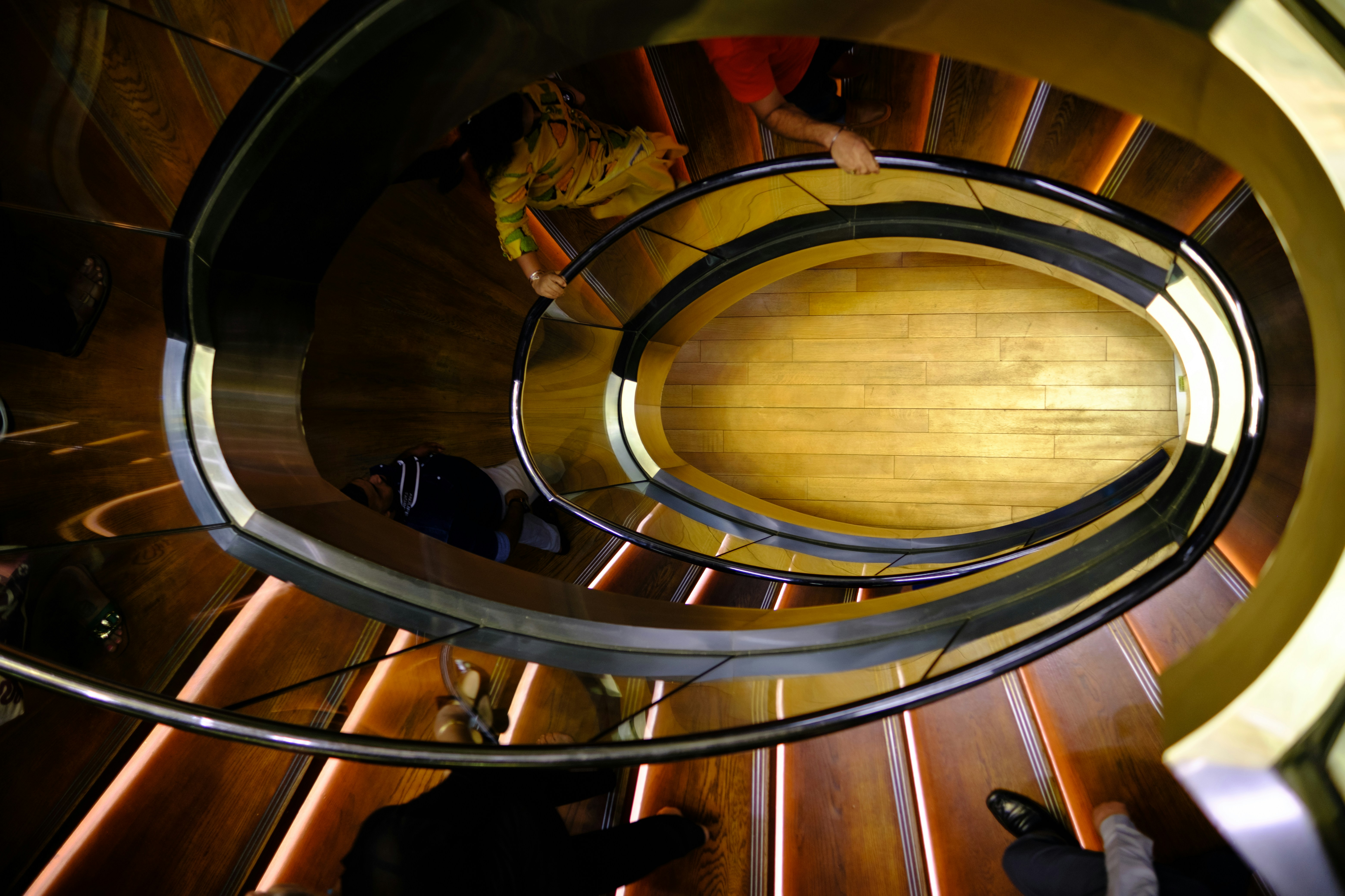 a group of people on a spiral staircase