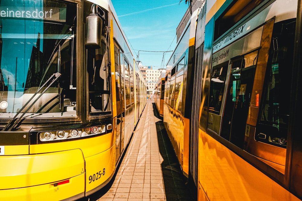 a couple of trains at a train station