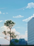 A tall tree stands in the foreground with a backdrop of clear blue sky scattered with fluffy white clouds. A modern high-rise building with numerous windows looms to the right, and cranes are visible in the distance, suggesting construction activity. The scene combines elements of nature and urban development.