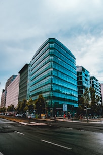 Contemporary commercial office space with glass facade and bustling city surroundings.