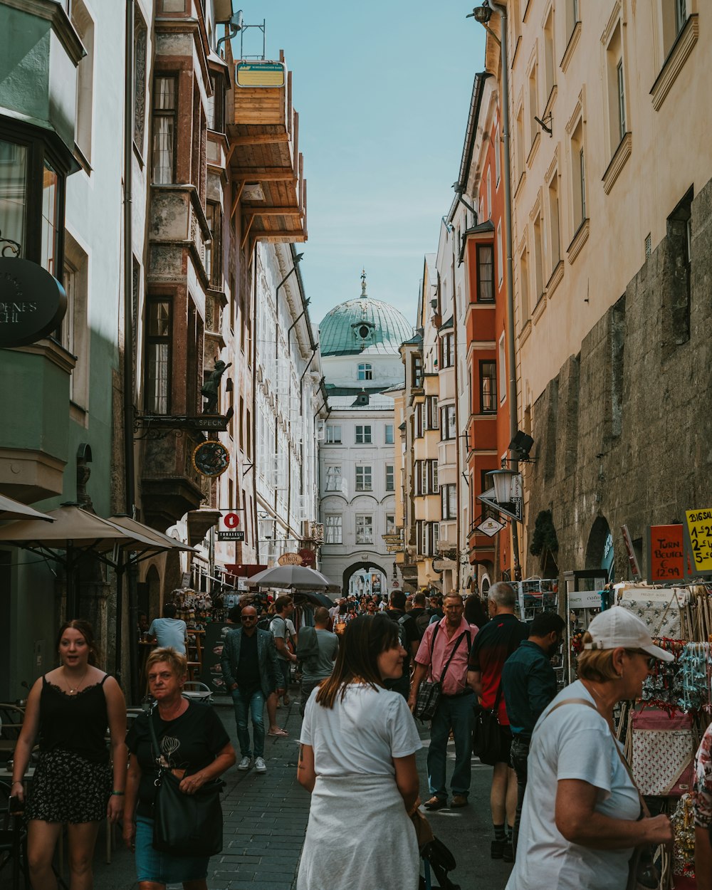 a crowd of people walking through a city