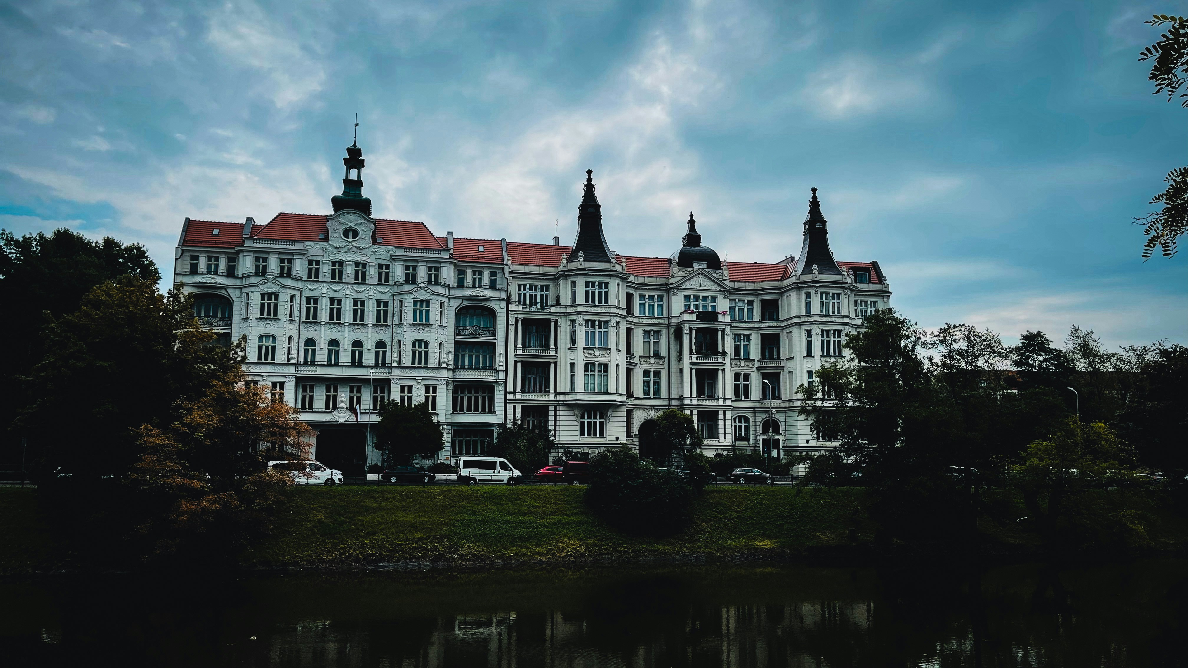 a large white building with a clock tower
