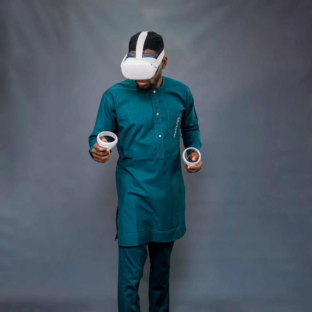 a person wearing a mask and holding a cup