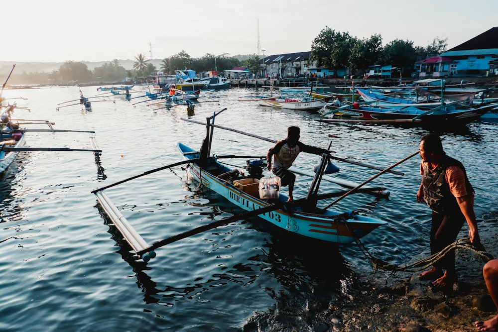 a couple of men on a boat