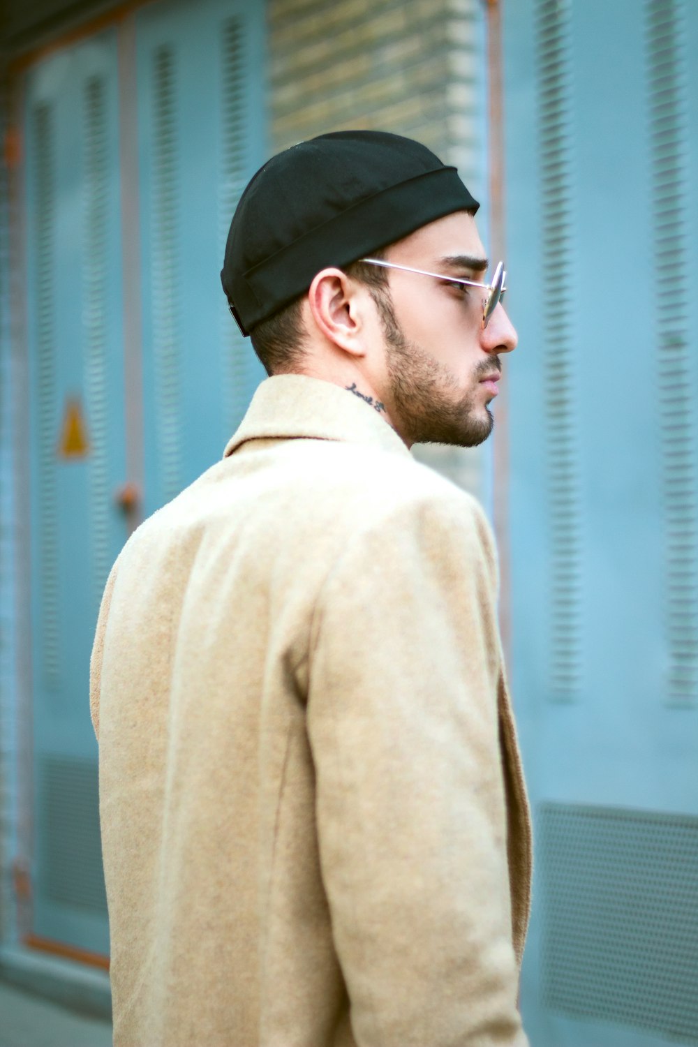 a man wearing a hat and glasses