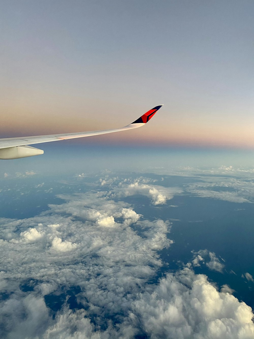 an airplane wing in the sky