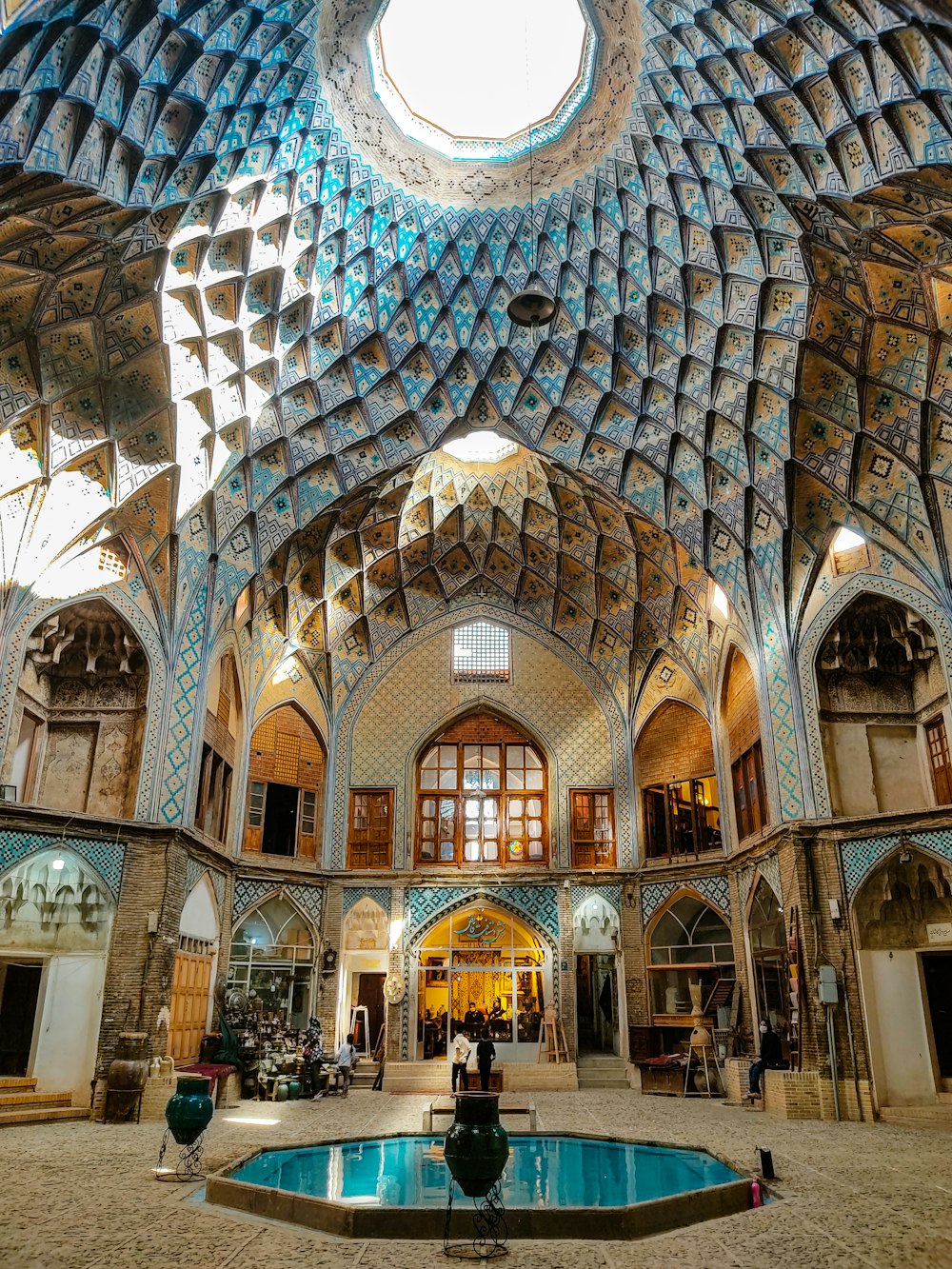 a large ornate building with a pool