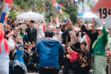 A lively group photo of alumni gathered at a community event in Canada