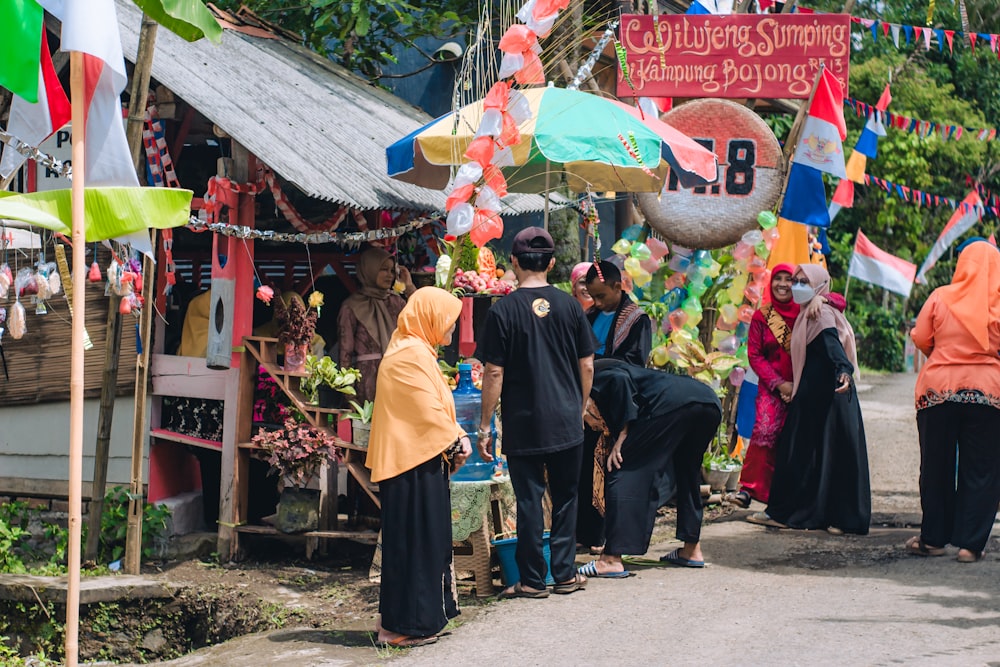 people standing outside a shop