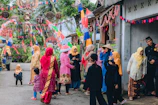 Photo of the consulate team coordinating a community event outdoors with banners displaying the Bangladesh flag.