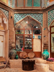 a window with vases and vases in front of it