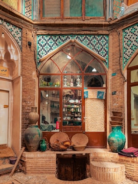 a window with vases and vases in front of it