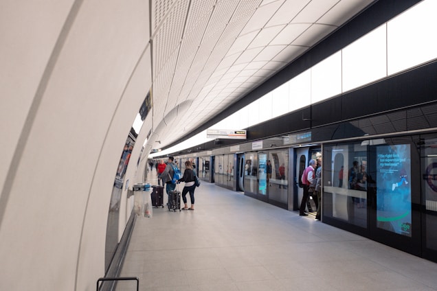 A sleek luggage locker station with NYC skyline in the background during golden hour.