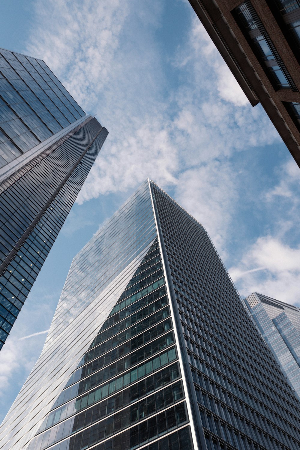 looking up at tall buildings