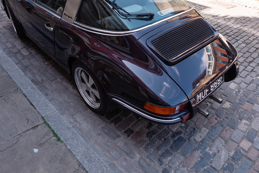 a car parked on a brick road