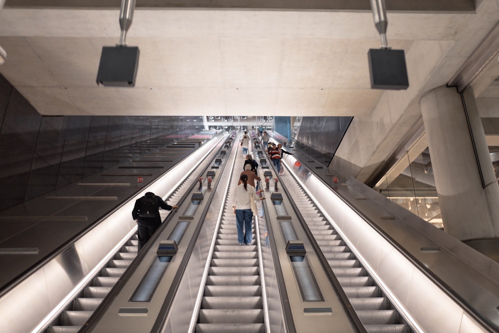 people with luggage in a train station