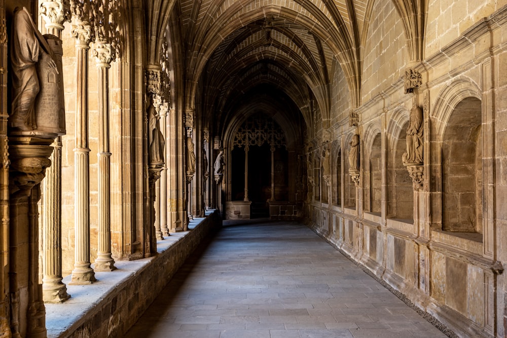 a hallway with statues