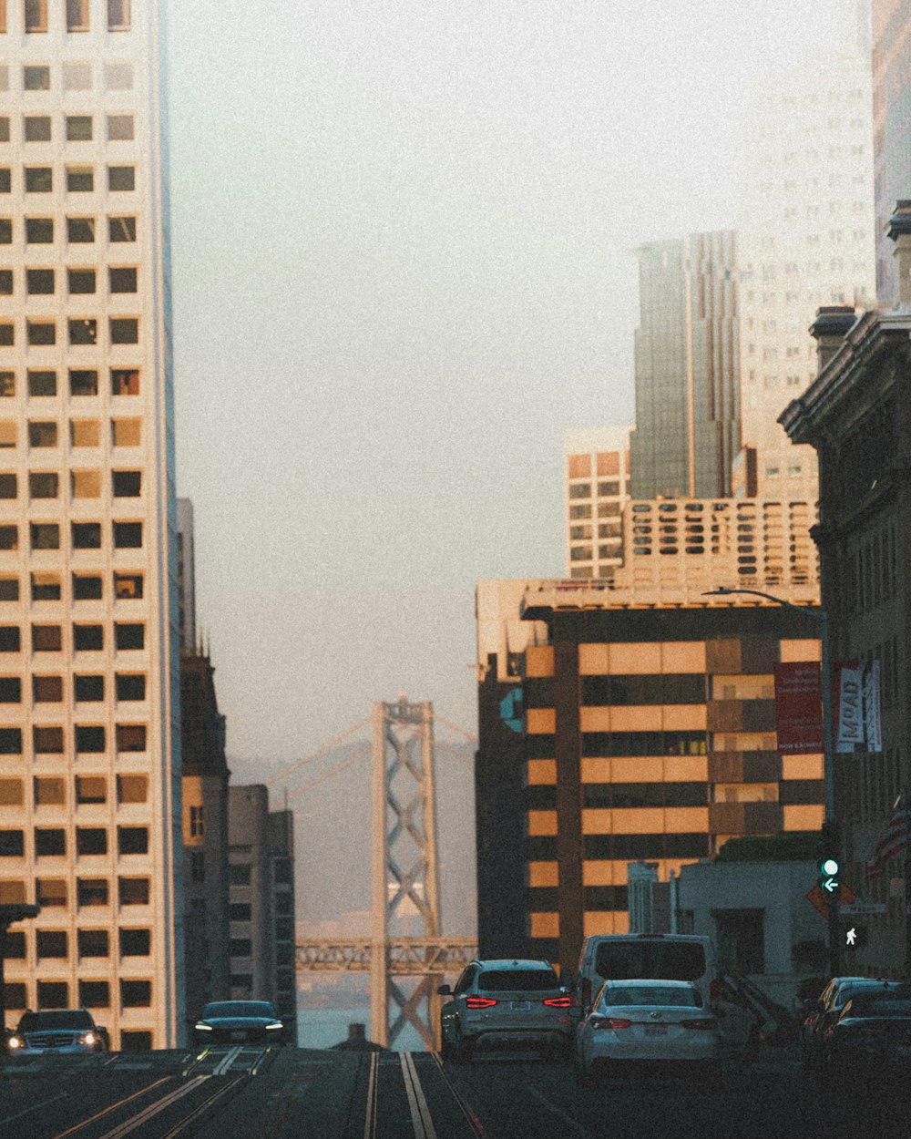 a city street with cars and buildings