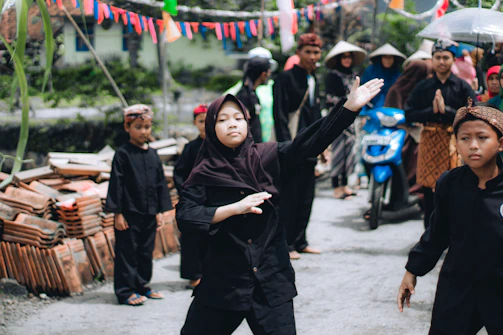 Community members gathered outdoors for a martial arts demonstration and cultural celebration.