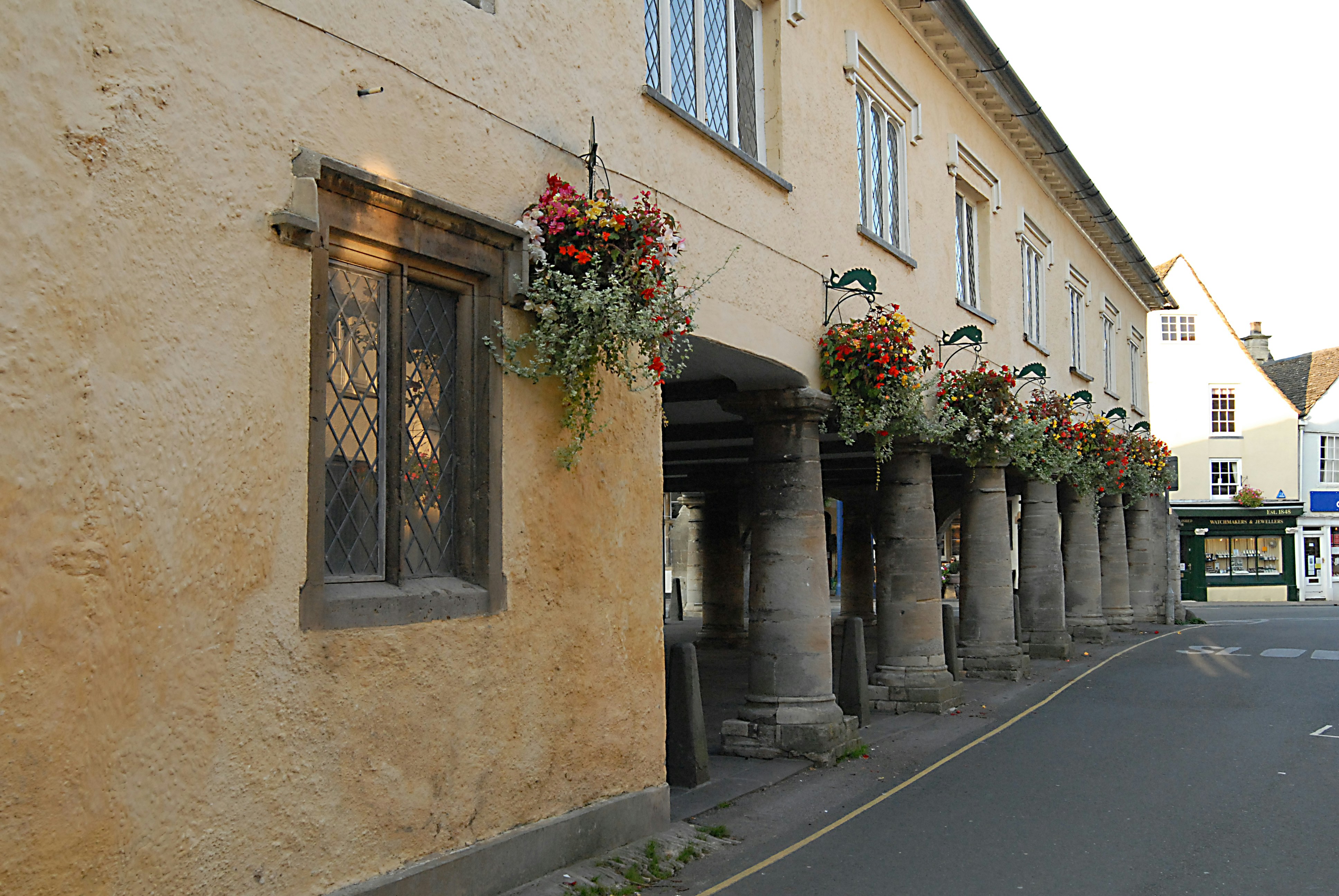 a building with flowers on the windows