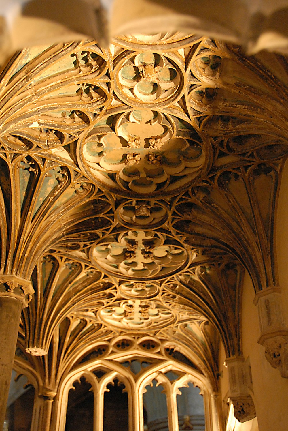 a gold ceiling with a design