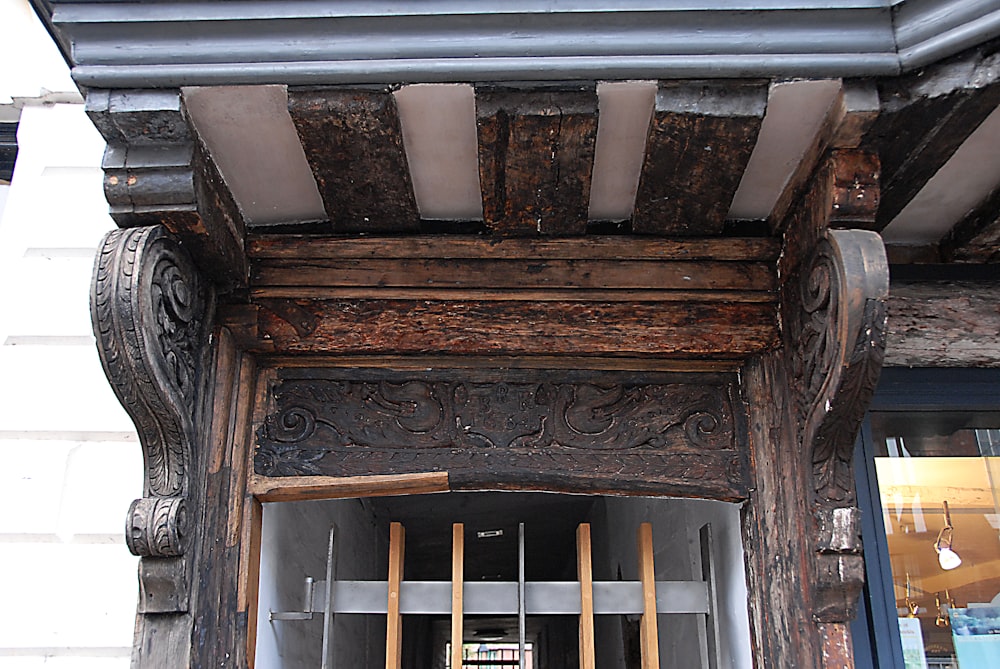 a wood cabinet with a door