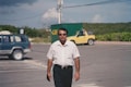 a man standing in a parking lot