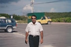 a man standing in a parking lot