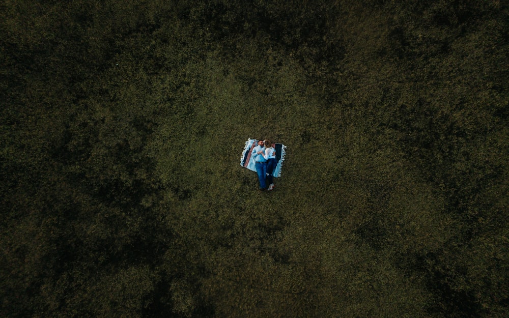 a man flying a kite in a field