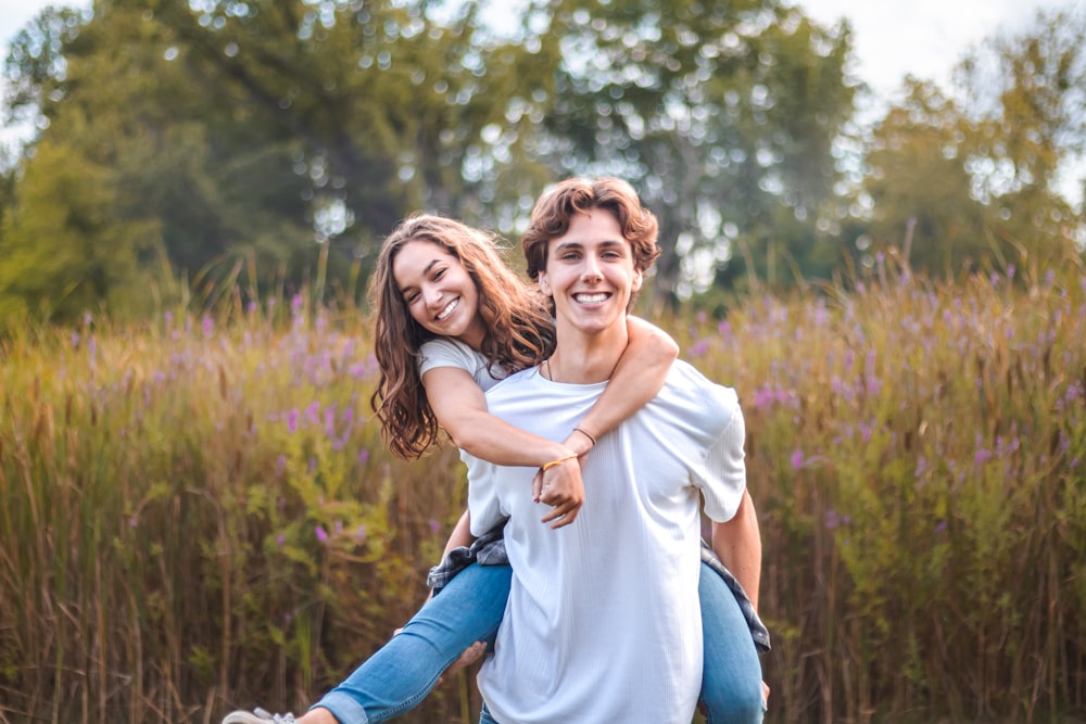 a person carrying a girl