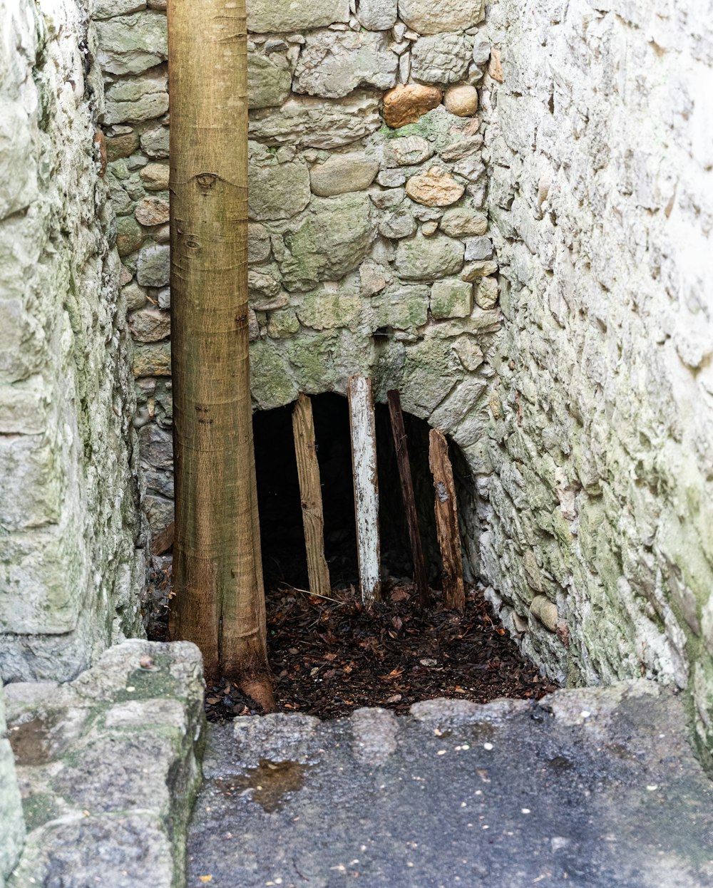 a stone building with a stone wall