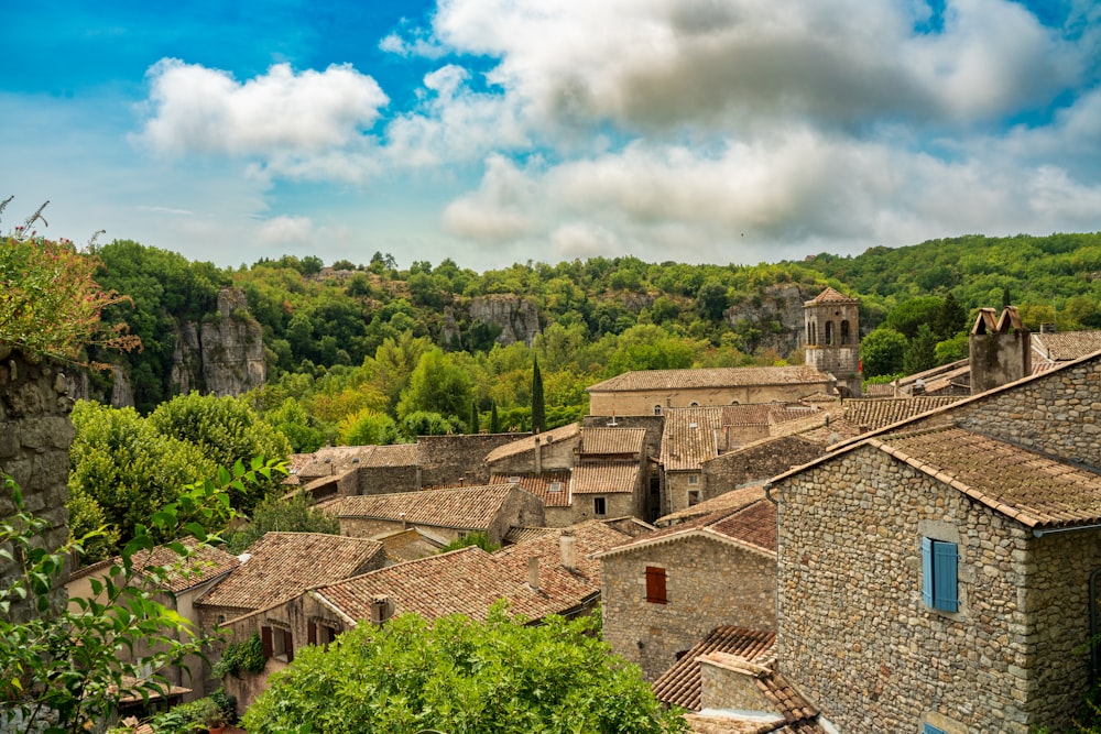 a group of buildings with trees in the back