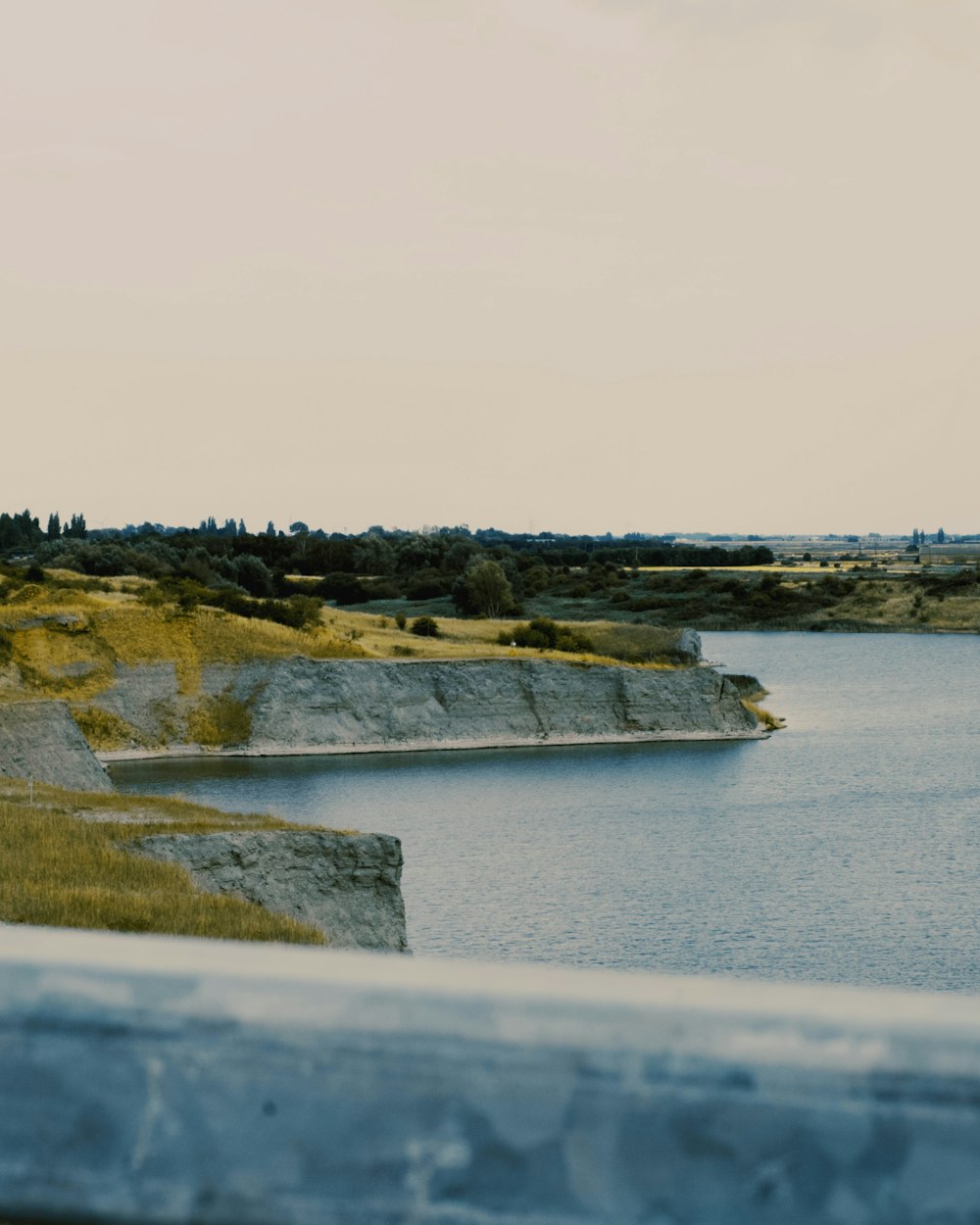 a body of water with land in the back