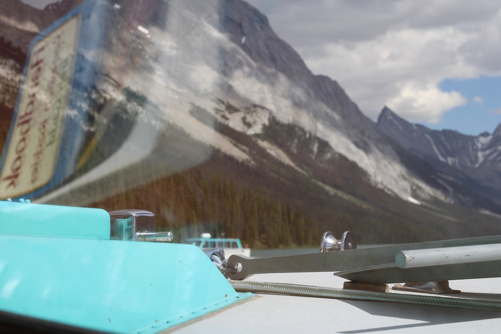 a mountain range with a blue and white object in front of it