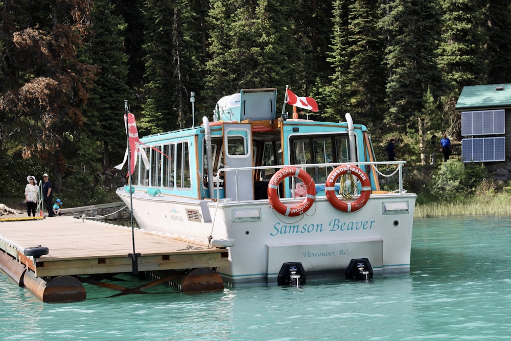 a boat is parked on the side of a river