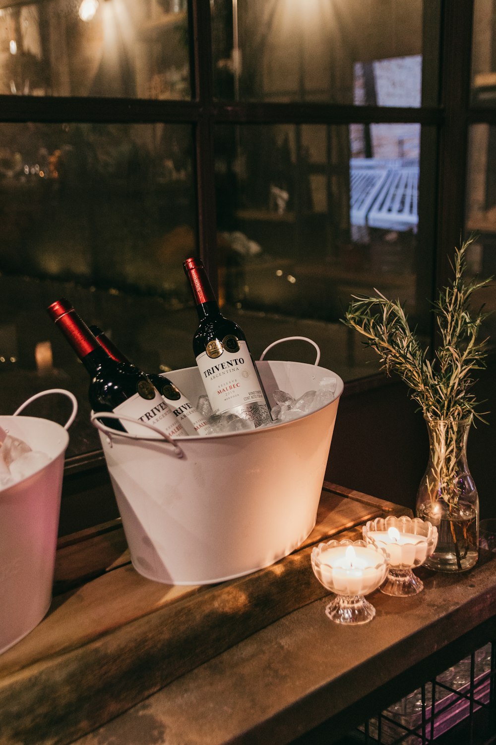 a bottle of wine and a glass of wine on a table