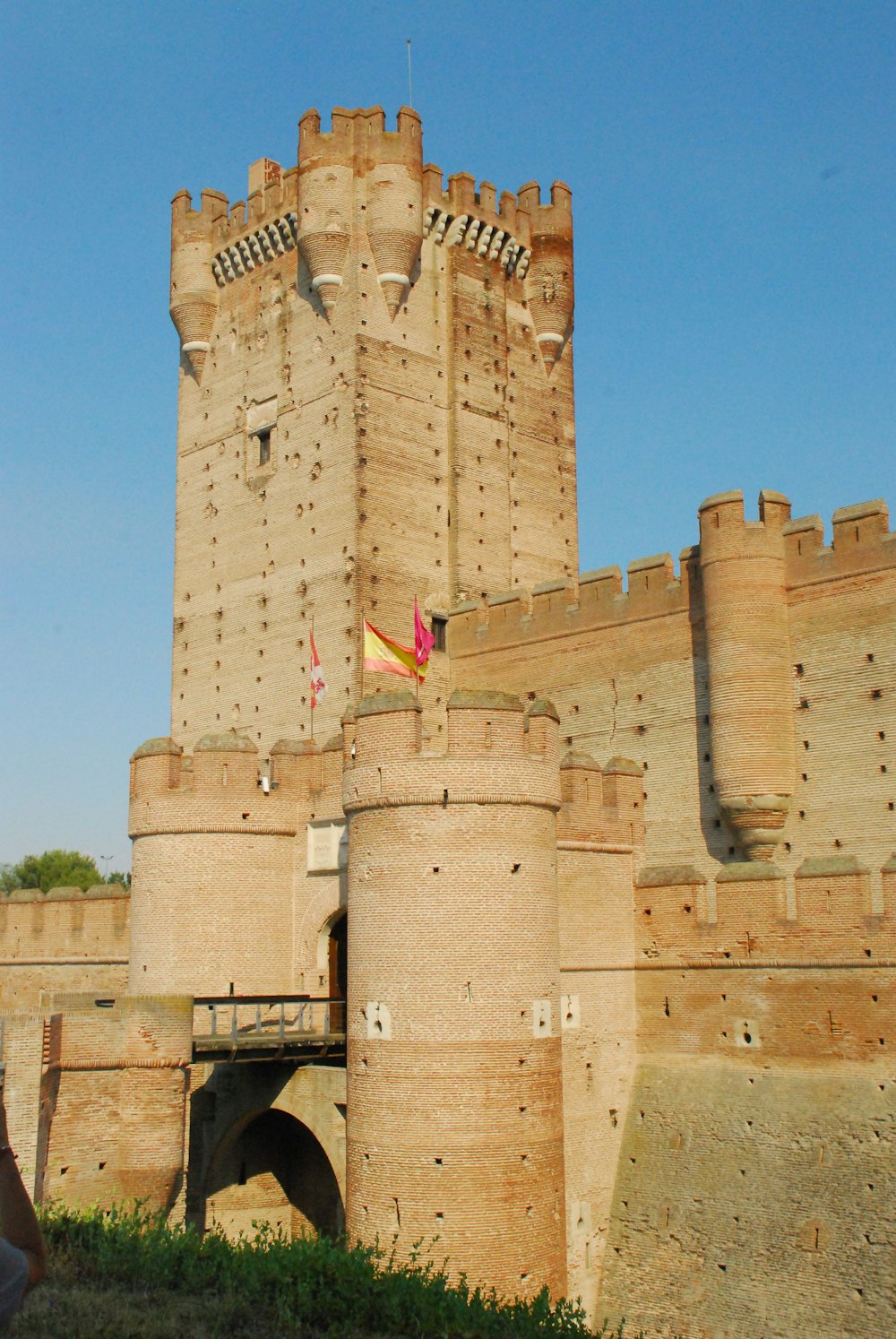a stone castle with flags