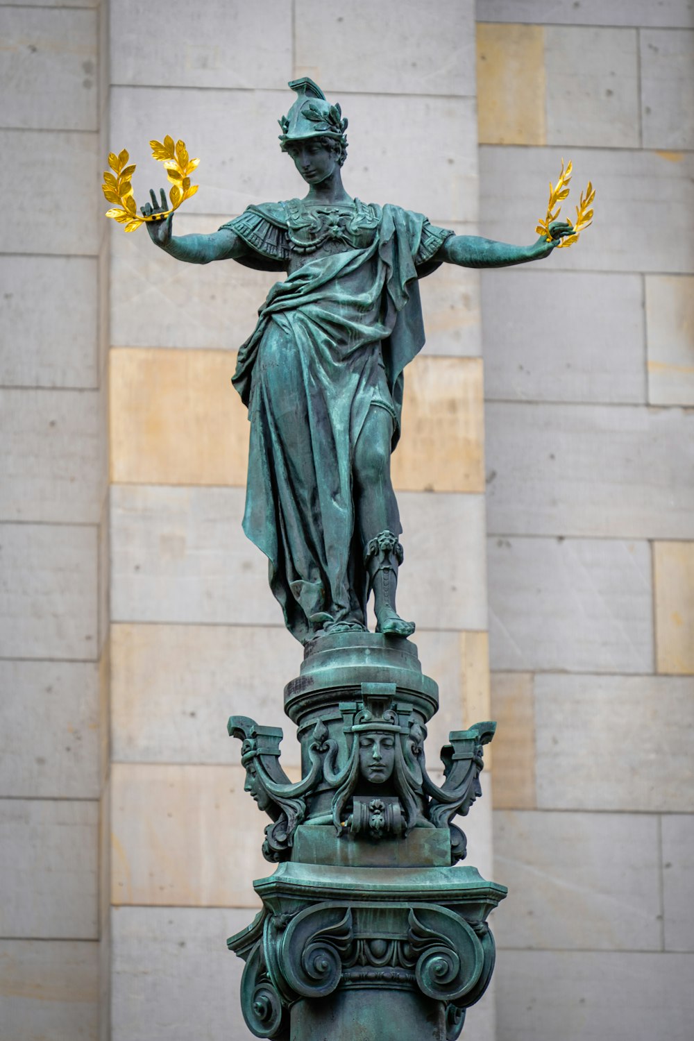a statue of a person holding flowers