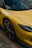 a yellow car with a black rim