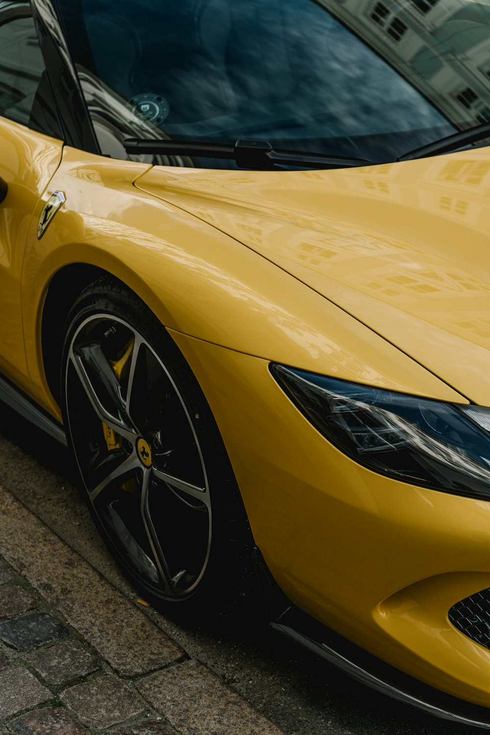 a yellow car with a black rim