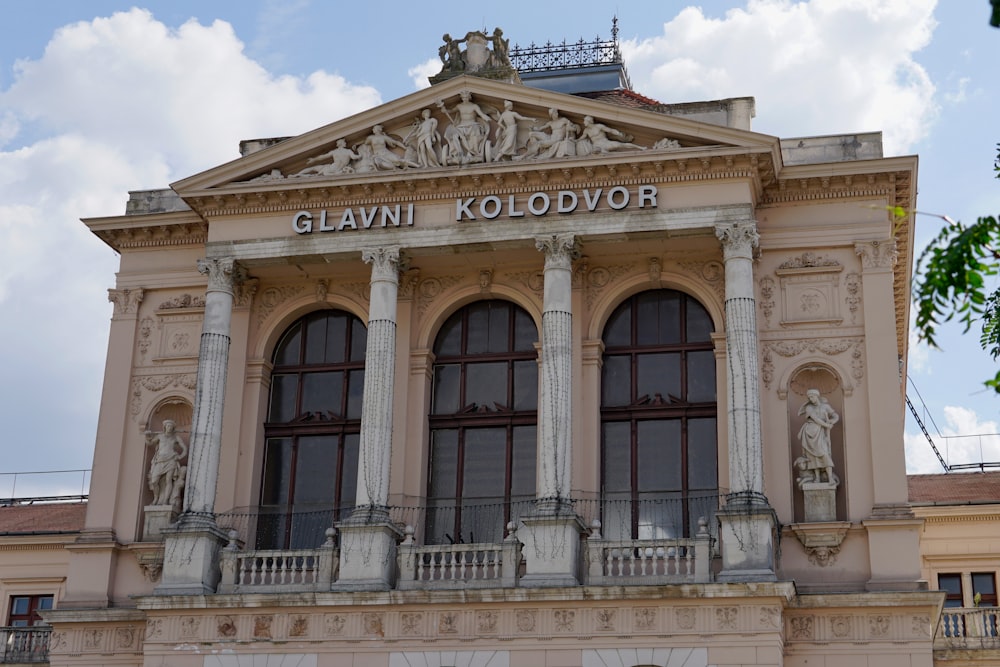 a building with statues on the front