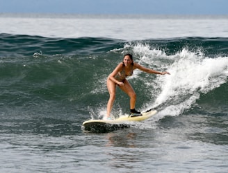 a person surfing on the waves