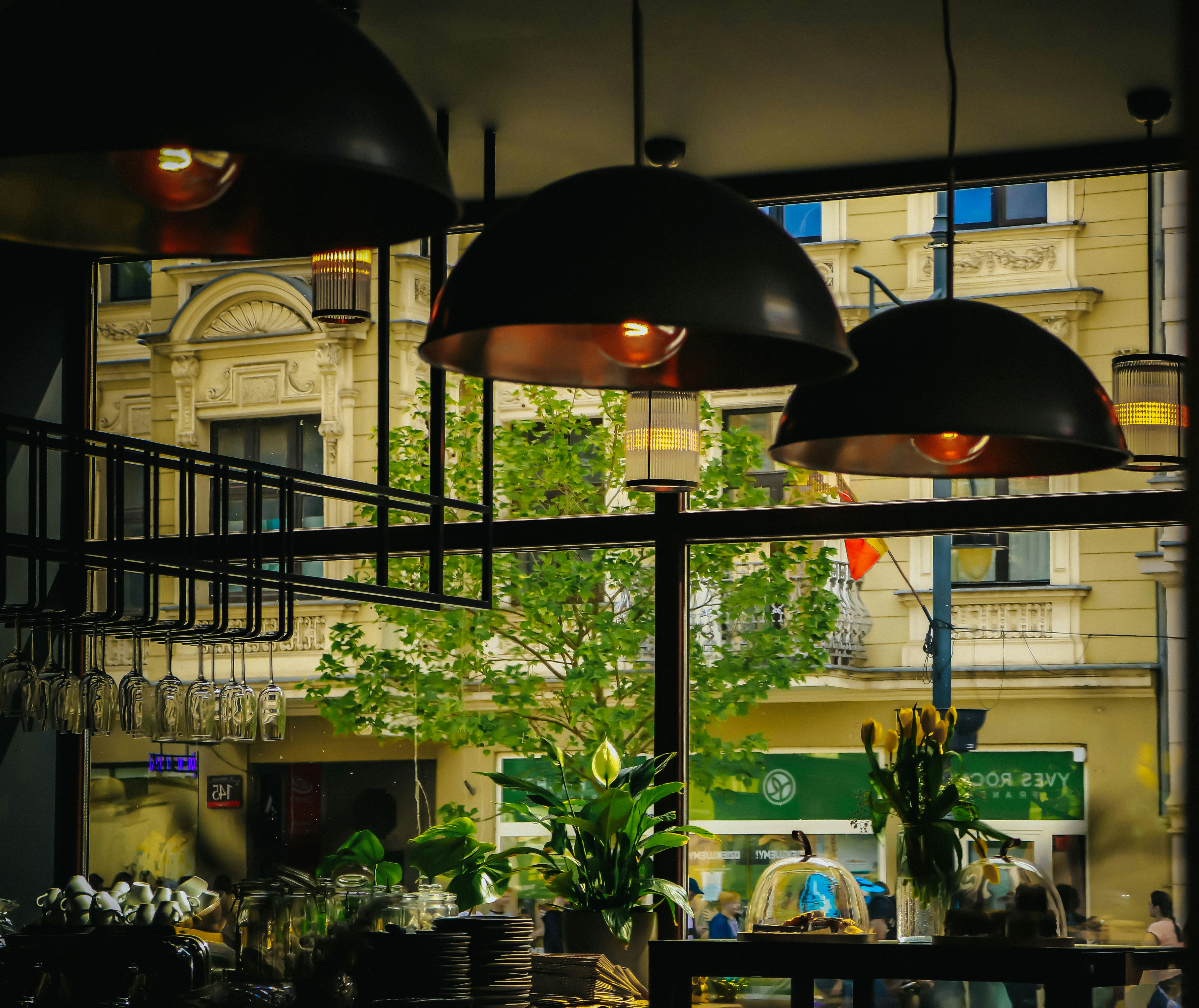 a restaurant with a large black lamp