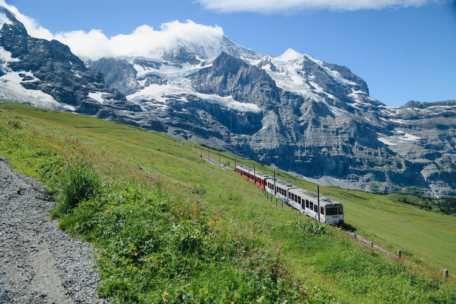 A mountain train climbing through the Alps