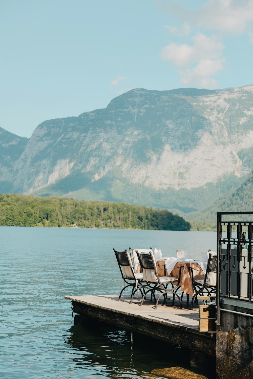 a table and chairs on a dock