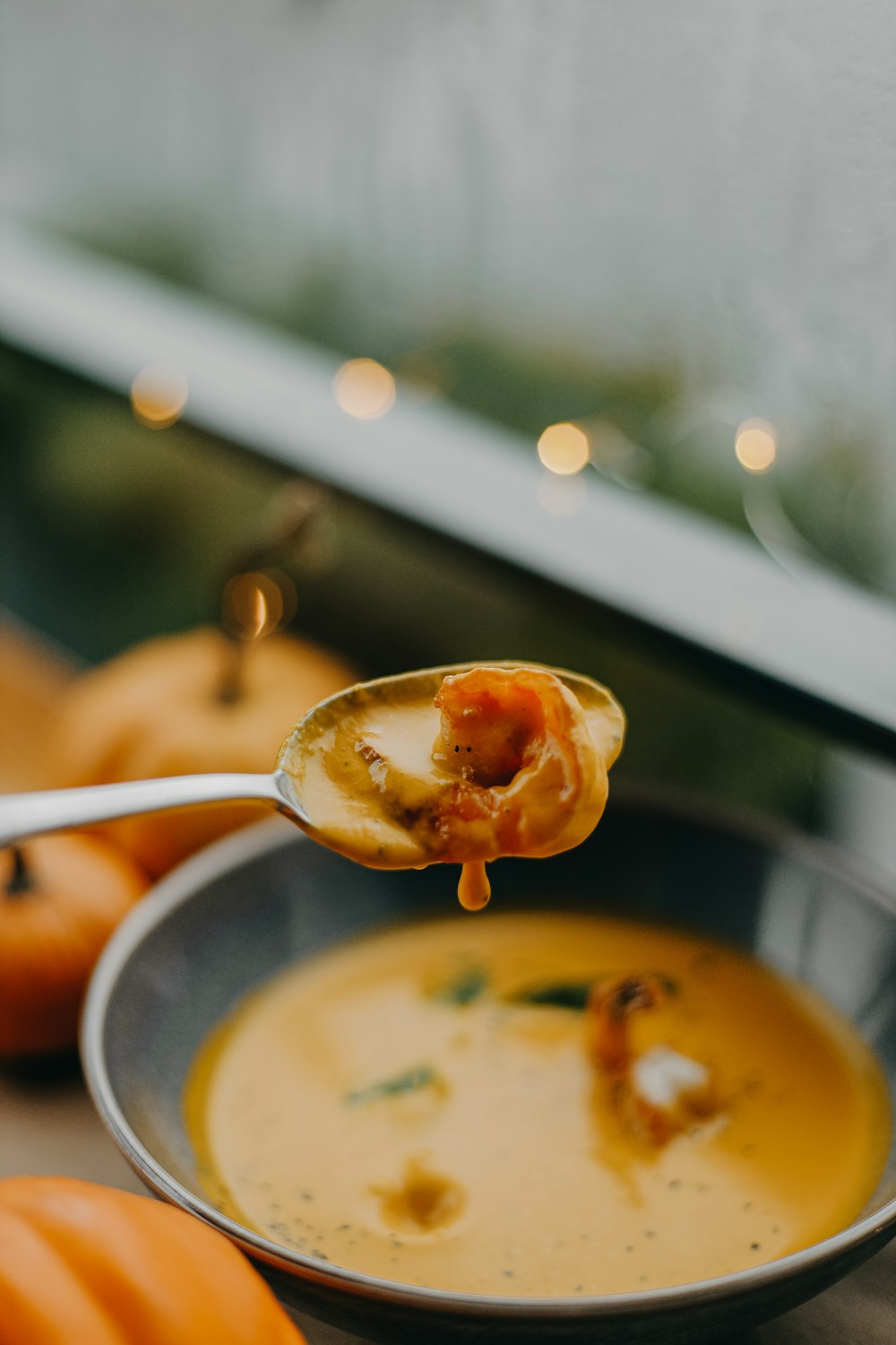 a spoon in a bowl of soup