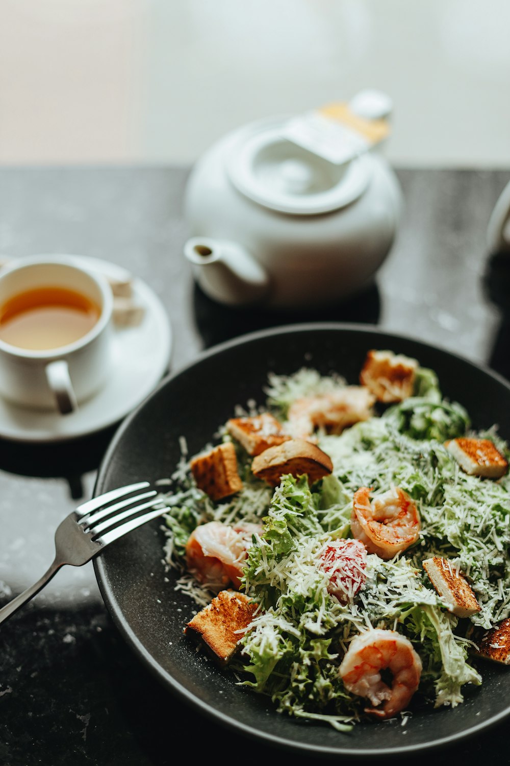 a plate of food and a cup of tea