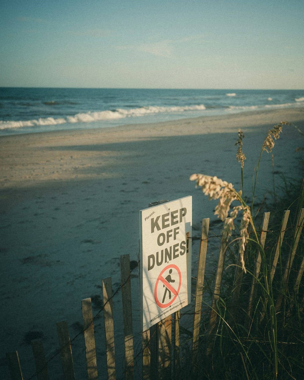 a sign on a beach